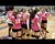 The Pink Maroons huddle up.